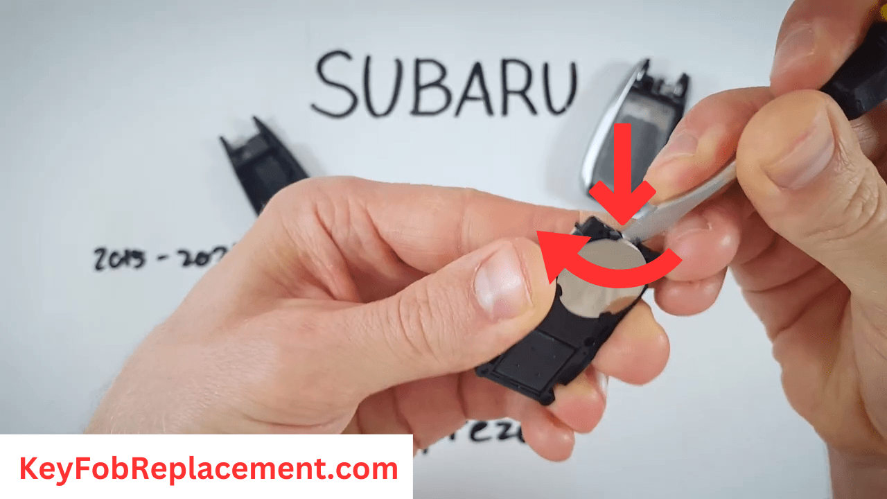 Flip circuit board, remove battery Subaru Impreza “Silver Sides” key fob