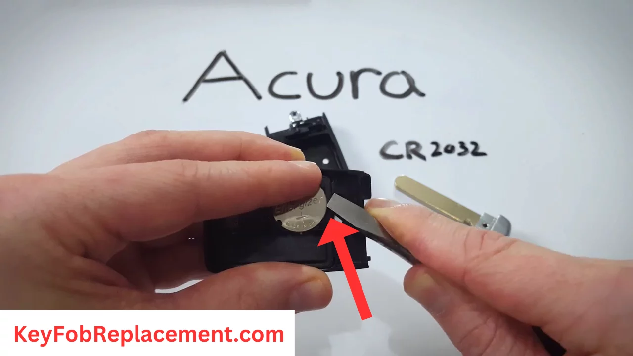 Gently pry out old Acura RDX Smart 4-Button key fob battery