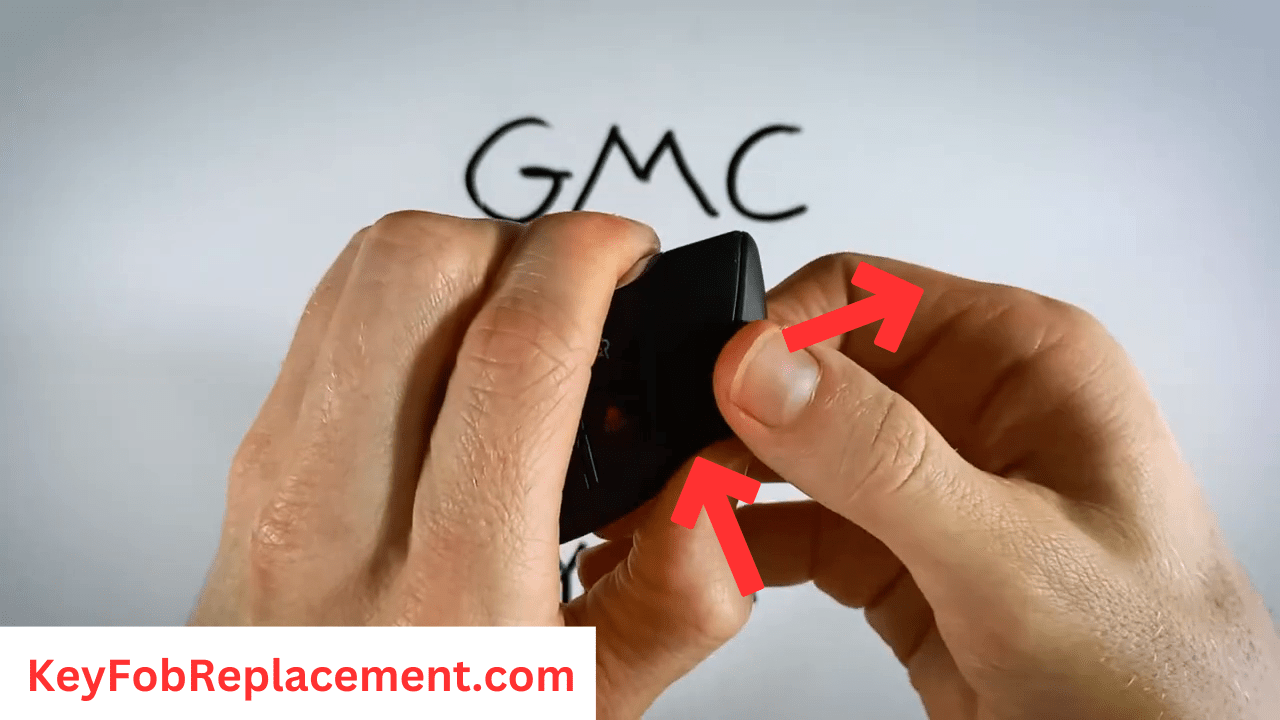 GMC key fob Hold side button, pull key out of fob