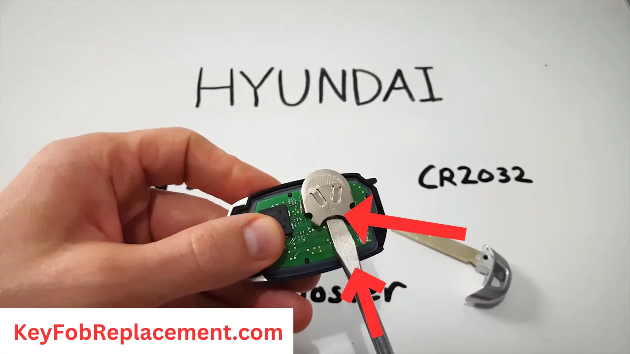 Hyundai Veloster Use screwdriver to release battery