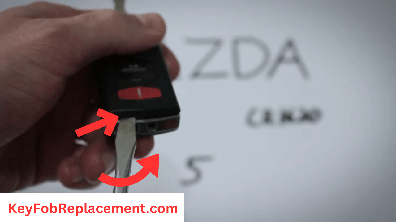 Mazda 5 Flip 3-Button Key Insert screwdriver at bottom, twist to access battery