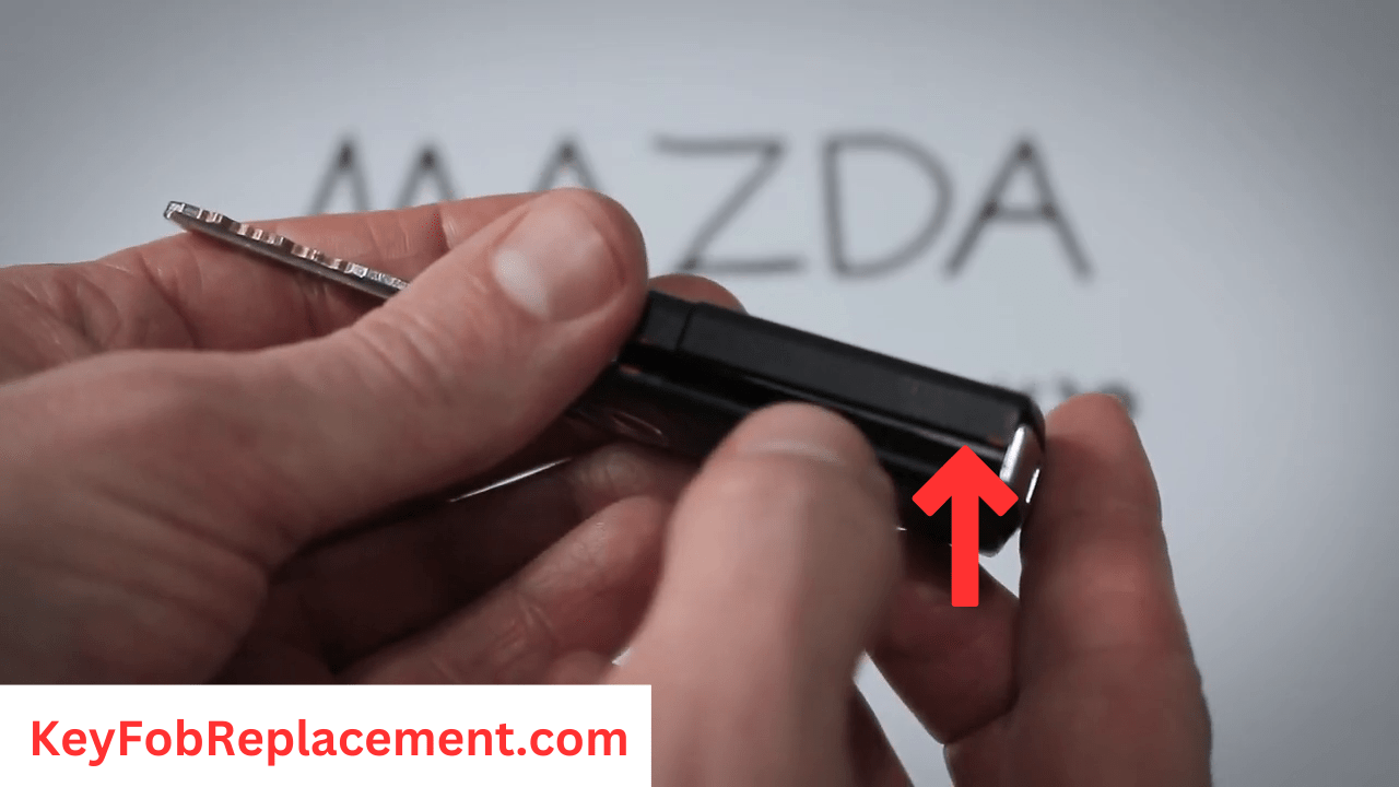 Mazda 5 Flip 3-Button Key Locate seam or light reflection then Insert screwdriver