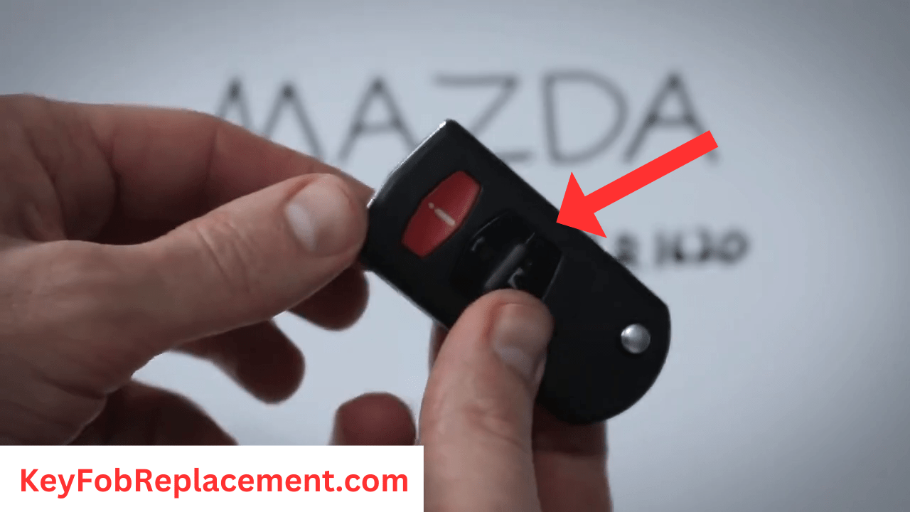 Mazda CX-7 Flip Key Reconnect key fob halves, insert metal key