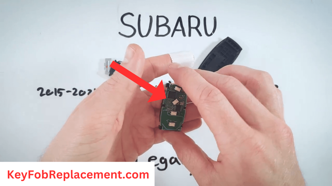 Subaru Legacy Remove battery holder, handle carefully
