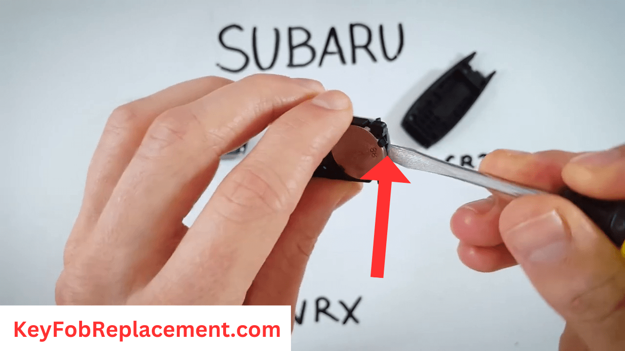 Subaru WRX Remove old battery with screwdriver