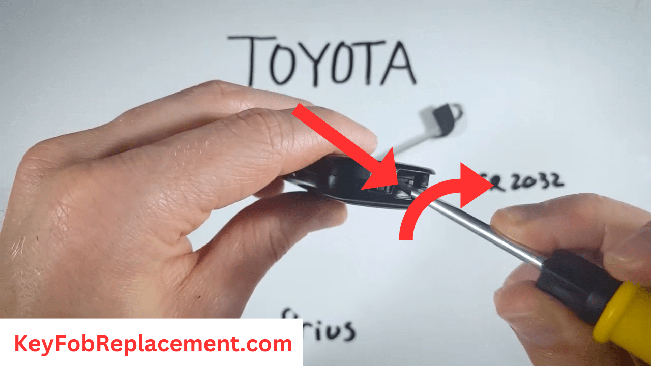Toyota Prius Key Insert screwdriver in indentation, twist